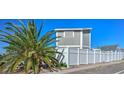 Home exterior showing fenced yard and a partial view of the house at 645 Utah St, Boulder City, NV 89005
