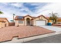 Charming single-story home with a two-car garage, low-maintenance rock landscaping, and desert climate adapted design at 6574 Curacao Dr, Las Vegas, NV 89156