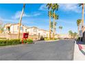 Sunhampton Residences gated community exterior view showing landscaping and palm trees at 7061 Roscoe Ave # 201, Las Vegas, NV 89129
