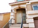 Close up of the front door with security screen and modern exterior light fixtures at 9739 Fox Estate St, Las Vegas, NV 89141