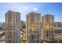 Luxury high-rise condos with gold-tinted windows offering city views and modern architectural design at 135 E Harmon Ave # 221, Las Vegas, NV 89109