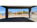 Eye-level view from the carport, offering a glimpse of the neighboring property at 1351 Huckleberry St, Pahrump, NV 89048