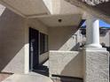 Covered entrance featuring a security door, textured walls, and a column detail at 1403 Santa Margarita St # D, Las Vegas, NV 89146