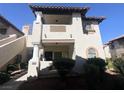 Charming condo featuring a second-story balcony, arched windows, and well-maintained landscaping at 1403 Santa Margarita St # D, Las Vegas, NV 89146