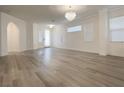 Bright living room with hardwood floors, arched doorway and lots of natural light at 150 Short Ruff Way, Las Vegas, NV 89148