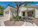 Close up of the front porch area and entrance with desert landscaping at 2024 Riva Del Garda Pl, Las Vegas, NV 89134