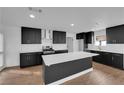 Modern kitchen with stainless steel appliances and a central island perfect for cooking at 2058 Citroen St, Las Vegas, NV 89142