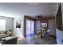 Bright living room featuring modern decor, ceiling fan, and access to the balcony at 2300 E Silverado Ranch Blvd # 1180, Las Vegas, NV 89183