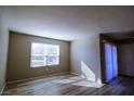 Bright and airy living room with light-colored wood floors and a large window at 2300 E Silverado Ranch Blvd # 1180, Las Vegas, NV 89183