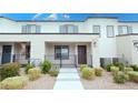 Contemporary home featuring a stucco facade, neat landscaping, and a welcoming front porch with modern railings at 3542 Arcadian King Ave, Las Vegas, NV 89106