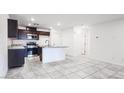 Well-lit kitchen featuring stainless steel appliances and a center island at 3542 Arcadian King Ave, Las Vegas, NV 89106