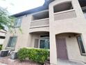 Multi-story building with private balconies and well-maintained landscaping at 3544 Desert Cliff St # 102, Las Vegas, NV 89129