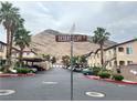 Scenic community street view with mountain backdrop and covered parking at 3544 Desert Cliff St # 102, Las Vegas, NV 89129