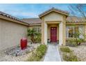 Welcoming front entrance with tiled walkway and desert landscaping at 422 Tanita Ct, Las Vegas, NV 89123