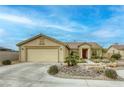 Inviting single-story home with desert landscaping and a two car garage at 422 Tanita Ct, Las Vegas, NV 89123