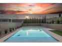 Backyard pool offers a serene escape with its pristine waters and well-manicured landscaping at 4243 Tarim St, Las Vegas, NV 89147