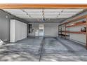 Spacious two-car garage with built-in shelving and ample storage space at 430 Wickenburg St, Henderson, NV 89015