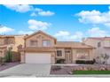 Charming two-story home featuring a tile roof, desert landscaping, and an attached two-car garage at 5000 Forest Oaks Dr, Las Vegas, NV 89149
