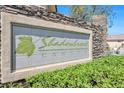 Decorative stone sign for Shadowbrook Canyon community, with lush green landscaping at 5218 Blue Gum Ct, Las Vegas, NV 89148