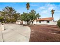 Single-story home with desert landscaping and a spacious curved driveway at 5248 W Lake Mead Blvd, Las Vegas, NV 89108