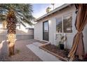 Private backyard patio with a tropical palm tree and potential for outdoor living at 5408 Longridge Ave, Las Vegas, NV 89146