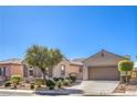 Beautiful single-story home with manicured desert landscaping and a two-car garage at 5525 Criollo Dr, Las Vegas, NV 89122