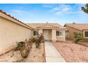 Inviting front entrance with a walkway leading to the front door, complemented by tidy landscaping at 6209 Lenaking Ave, Las Vegas, NV 89122