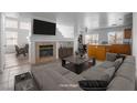 Inviting living area featuring a fireplace, open layout, and seamless connection to the kitchen at 6276 Back Woods Rd, Las Vegas, NV 89142