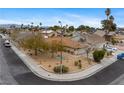 Neighborhood aerial view showing a well-maintained single-story home with desert landscaping on a corner lot at 6858 Groveview Ln, Las Vegas, NV 89103
