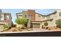 Stylish two-story home with a neutral color palette, lush landscaping, and a private garage at 6901 Whisper Canyon Pl, North Las Vegas, NV 89084