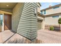 Close up on a the front door and porch of a modern two story home at 6901 Whisper Canyon Pl, North Las Vegas, NV 89084