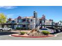 View of the apartment buildings with covered parking and well-maintained landscaping at 8600 W Charleston Blvd # 1075, Las Vegas, NV 89117