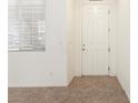 Bright entryway features neutral walls, tiled floor, and a white front door at 9268 Wildfire Gorge St, Las Vegas, NV 89139