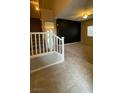 Living room with carpet flooring, a ceiling fan, and a staircase to the upper level at 9394 Vital Crest St, Las Vegas, NV 89123