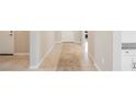 Bright hallway with tile flooring and neutral colored walls at 127 Crimson Cactus Ave, Henderson, NV 89011