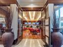 Restaurant entrance featuring stylish decor, red seating, and visible menu boards at 135 E Harmon Ave # 2104, Las Vegas, NV 89109