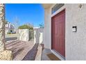 Close-up of the home's entry, featuring a modern doorbell and a freshly painted door at 1712 Warrenville St, Las Vegas, NV 89117
