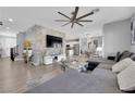 Spacious living room features modern decor, a stylish fan, and an open-concept layout at 1836 Soto Ln, North Las Vegas, NV 89032