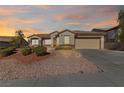 Charming single-story home featuring a well-manicured landscape and a two-car garage at 2920 Foxtail Creek Ave, Henderson, NV 89052