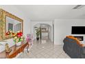 Inviting entryway with tile flooring, decorative mirror, and an open view into other living spaces at 2963 Greendale St, Las Vegas, NV 89121