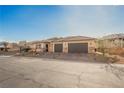 Beautiful single story home featuring a neutral palette, two car garage, and desert landscaping at 479 Apogee, Mesquite, NV 89027
