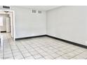 Bright living room featuring tiled flooring and neutral wall colors at 520 S 13Th St # D17, Las Vegas, NV 89101