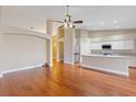 Spacious living room featuring hardwood floors, neutral walls, and open floor plan at 580 Kenerly St, Henderson, NV 89015