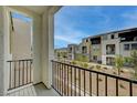 Balcony view showcasing the community's modern architecture and desert landscape at 6261 Dolosonte St, Las Vegas, NV 89113