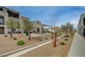Community space with picnic tables, a gazebo, desert landscaping, and walkways at 6261 Dolosonte St, Las Vegas, NV 89113