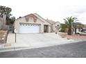 Charming single-story home with a two-car garage and low maintenance desert landscaping at 7233 Alsop Ct, Las Vegas, NV 89156