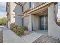 Inviting front entrance featuring a modern door and low-maintenance landscaping at 823 Safflower Ct, Henderson, NV 89015