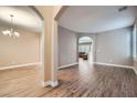 Spacious living room with wood flooring and neutral tones, perfect for entertaining at 823 Safflower Ct, Henderson, NV 89015