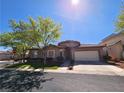 Charming single story home featuring a two car garage, well-maintained landscaping, and classic architecture at 10475 Rose Park Ave, Las Vegas, NV 89135