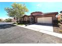 Charming single story home featuring a two car garage, well-maintained landscaping, and classic architecture at 10475 Rose Park Ave, Las Vegas, NV 89135